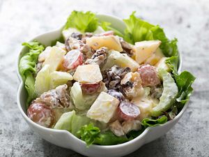 A Waldorf Salad in a scalloped white bowl