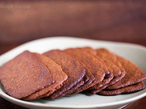 A plate of thin and crispy gingersnap cookies