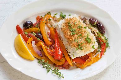 Halibut with peppers and onion on plate