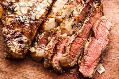 Sliced grilled steak on a cutting board