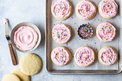 How to Make Soft Sugar Cookies frost the cookies and put sprinkles on them