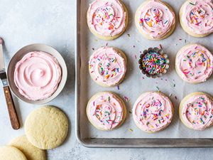 How to Make Soft Sugar Cookies frost the cookies and put sprinkles on them