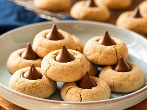 Peanut butter blossoms in a wide ceramic bowl.