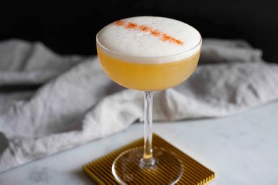 Whiskey sour cocktail with egg white foamy top