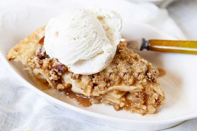 Single slice of easy dutch apple pie with a scoop of ice cream