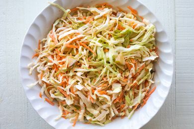 Pickle slaw with cabbage, carrots, and pickle juice in a bowl