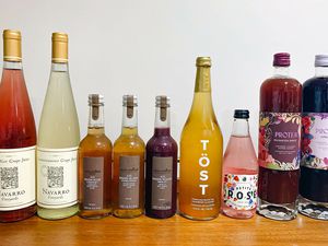 Non-alcoholic wines lined up on a table.