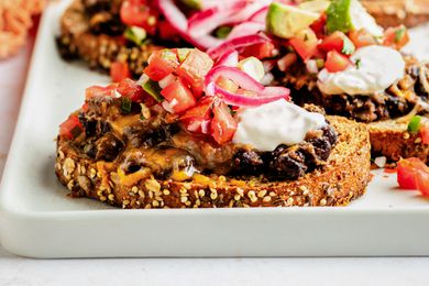 Black bean toast on a platter with lots more