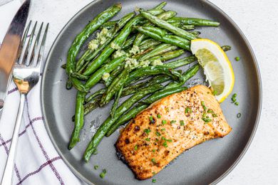 Air Fryer Dijon Salmon with Charred Green Beans and a Lemon Wedge