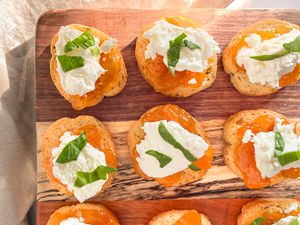 3-ingredient appetizers (goat cheese crostini) on a wooden board