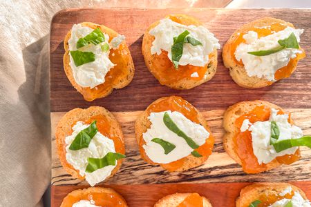 3-ingredient appetizers (goat cheese crostini) on a wooden board