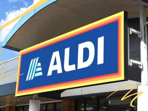 Aldi storefront photo with some yellow line illustrations