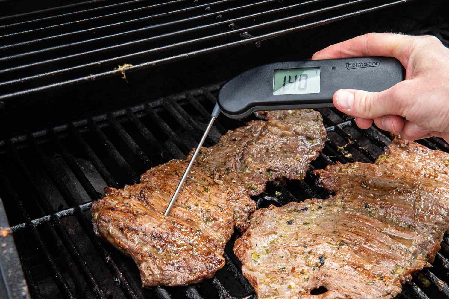 Cooking Thermometer Used to Check Internal Temperature of Arrachera on the Grill