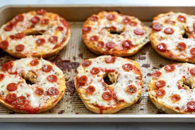 Pizza bagel on a sheet pan. 