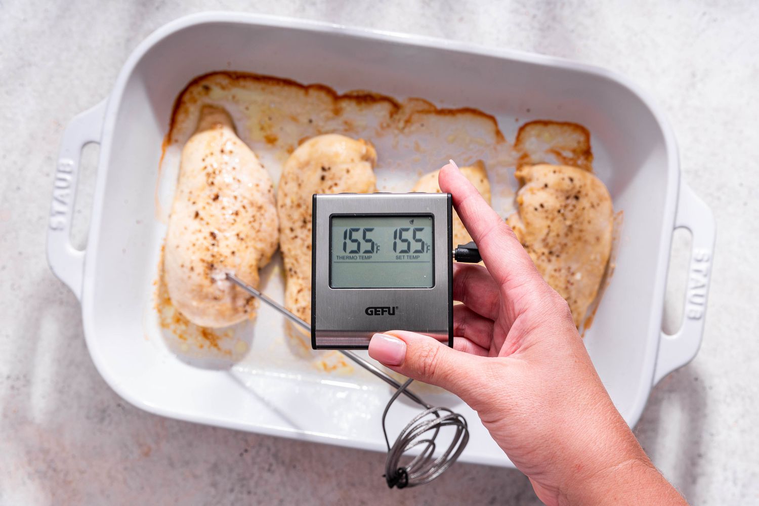 Electric thermometer reading 155F when internal temperature of the chicken is checked