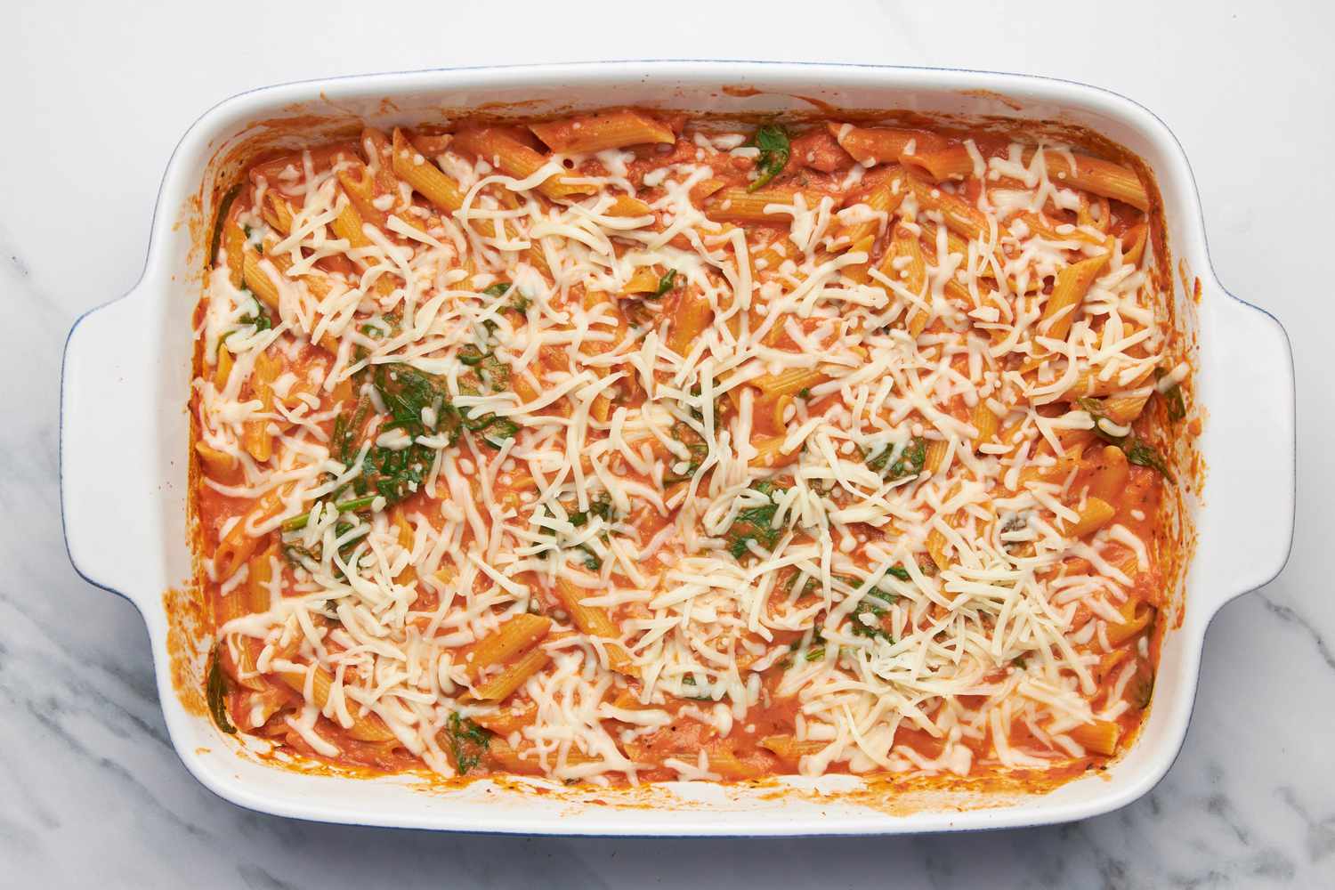 One pan baked penne alla vodka topped with shredded cheese