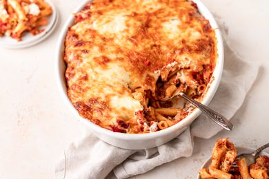 Oval baking dish filled with a cheesy pasta bake