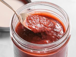 Spoonful of Banana Ketchup Lifted from Jar 