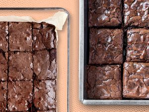 One pan of brownies in a glass dish and another in a steel baking pan on an orange dotted background