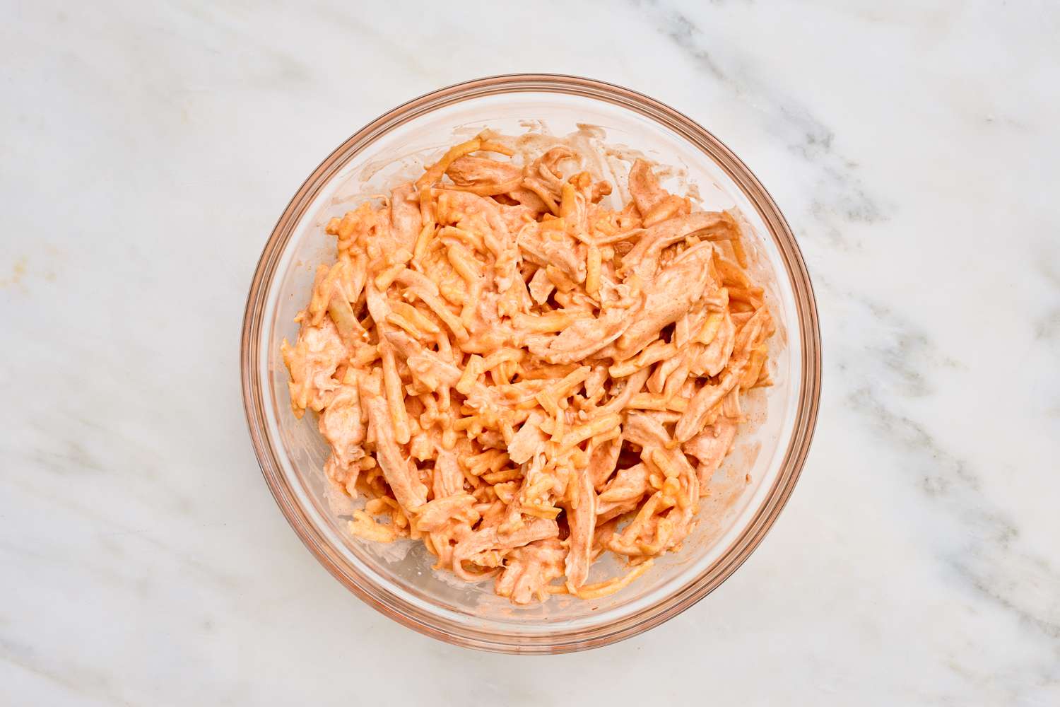 Bowl of buffalo chicken mixed together for easy buffalo chicken quesadilla recipe