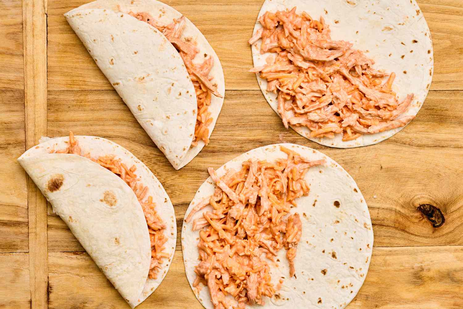 Buffalo chicken dip filling added to tortillas and then folded in half to make 5-ingredient buffalo chicken dip tortillas recipe