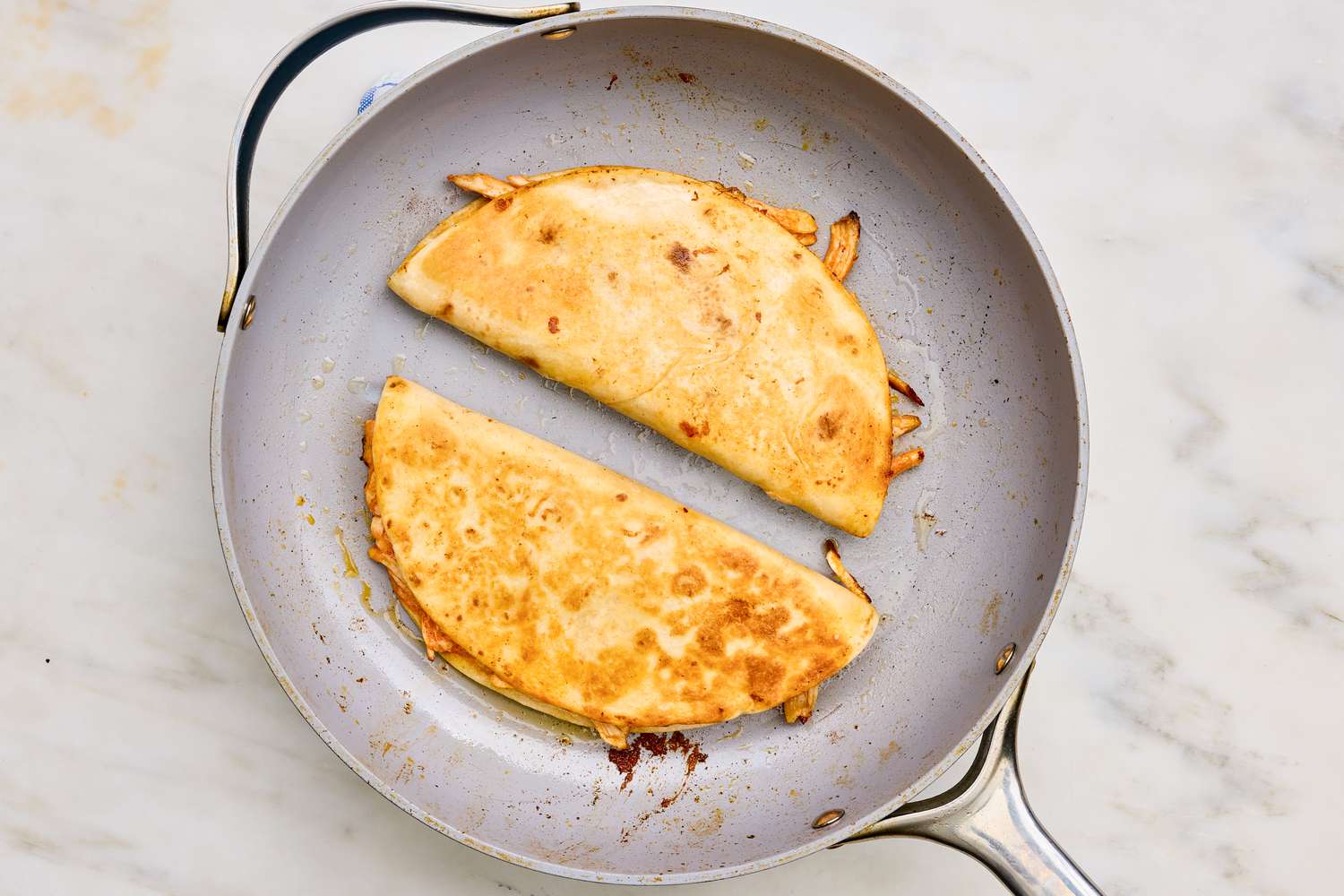 Buffalo chicken quesadillas flipped to toast the other side