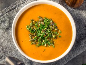 butternut squash soup in a white bowl