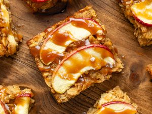 Overhead shot: caramel apple oatmeal bars on a wooden surface