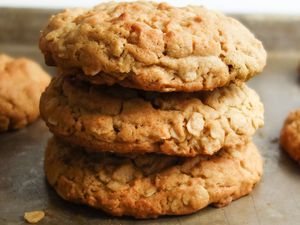 Pile of Chewy Peanut Butter Oatmeal Cookies on a Baking Sheet