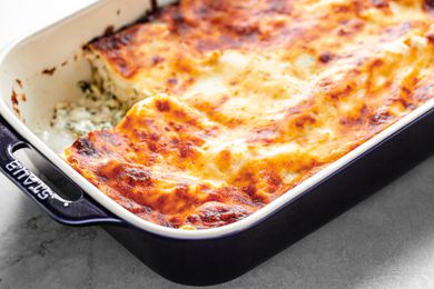 Chicken Lasagna in a Casserole Dish with a Slice Missing