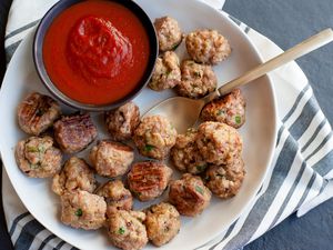 Baked chicken meatballs with marinara sauce.