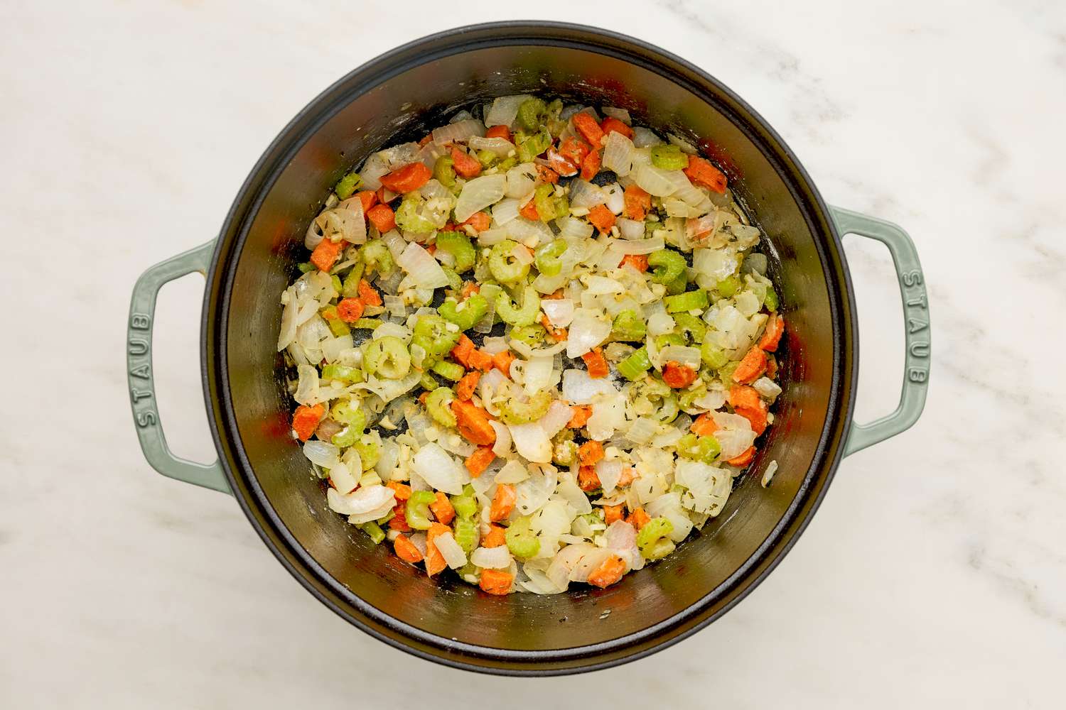 Flour added to a Dutch oven and mixed in with the stock vegetables for chicken pot pie soup recipe