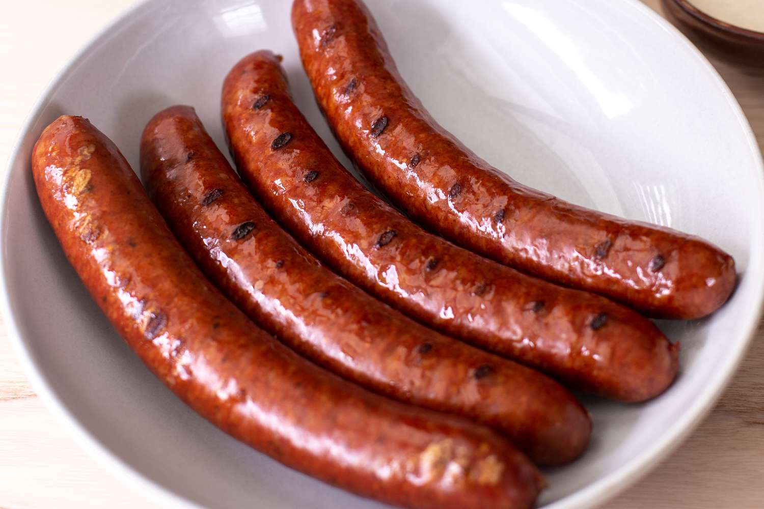 Cooked Pork Links Resting a Bowl