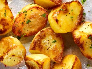 close up - roasted crispy potatoes on a sheet pan