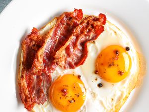 Plate with fried eggs and bacon