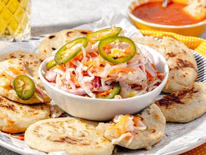 Curtido Served in a Bowl with Pupusas