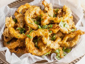 Platter of Delicata Squash Pakoras Topped with Chopped Cilantro 