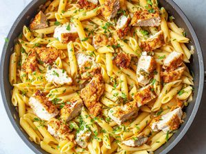 Overhead view of a skillet of chicken piccata pasta