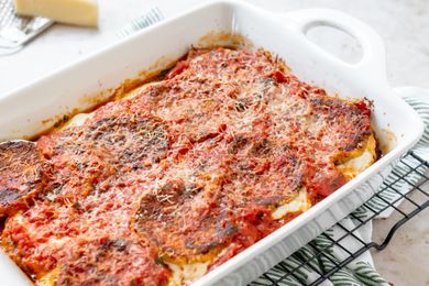 Baked eggplant parmesan in a casserole dish.