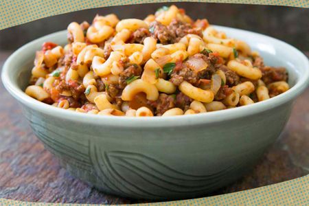 Photo of Elise's hamburger helper in a bowl surrounded by dark yellow and blue illustrations 