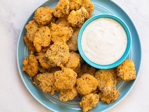 Plate of Fried Pickles Served with a Bowl of Dressing