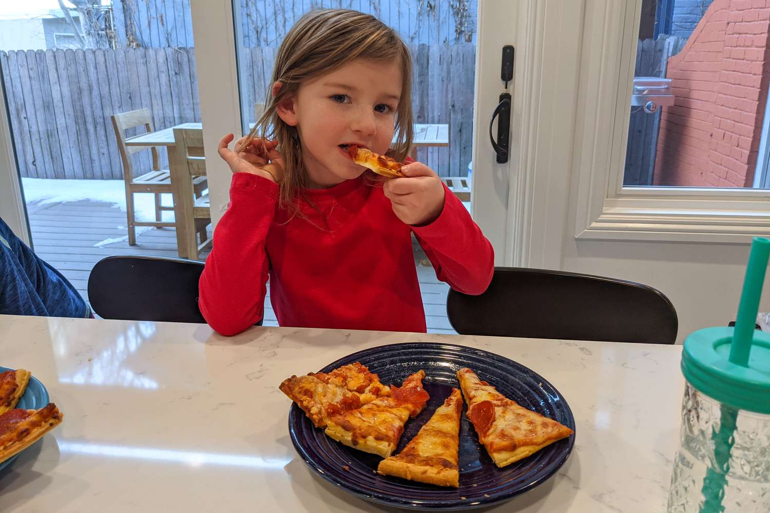 Kid eating frozen pizza