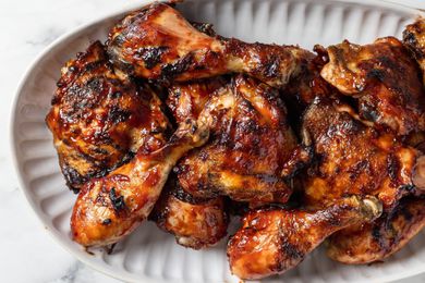 Overhead view of grilled chicken legs and thighs