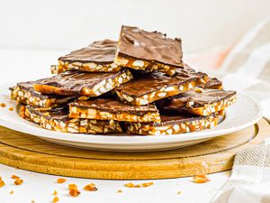 Side view of roca candy piled on a plate.