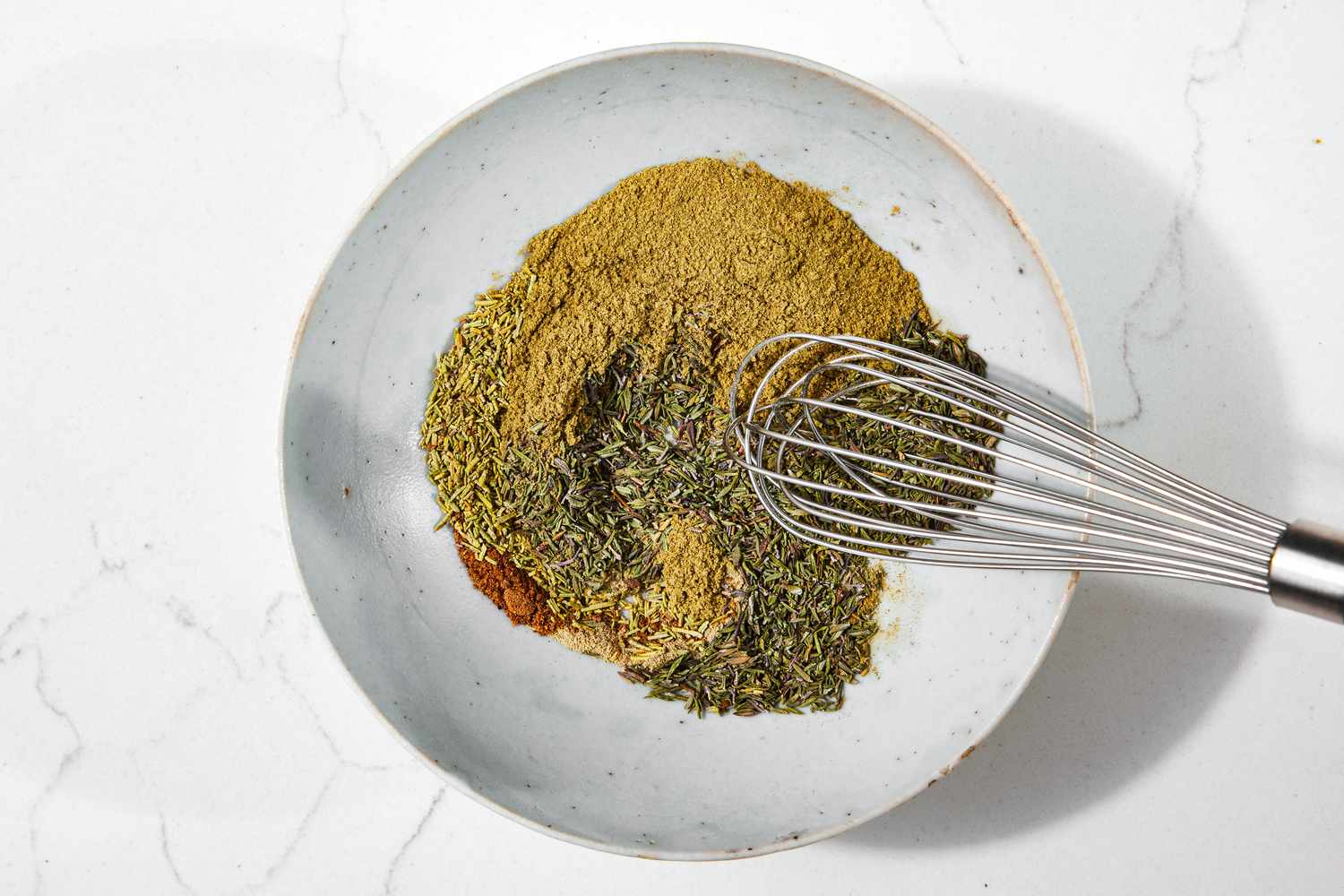 Spices Whisked Together in the Bowl for Poultry Seasoning Recipe