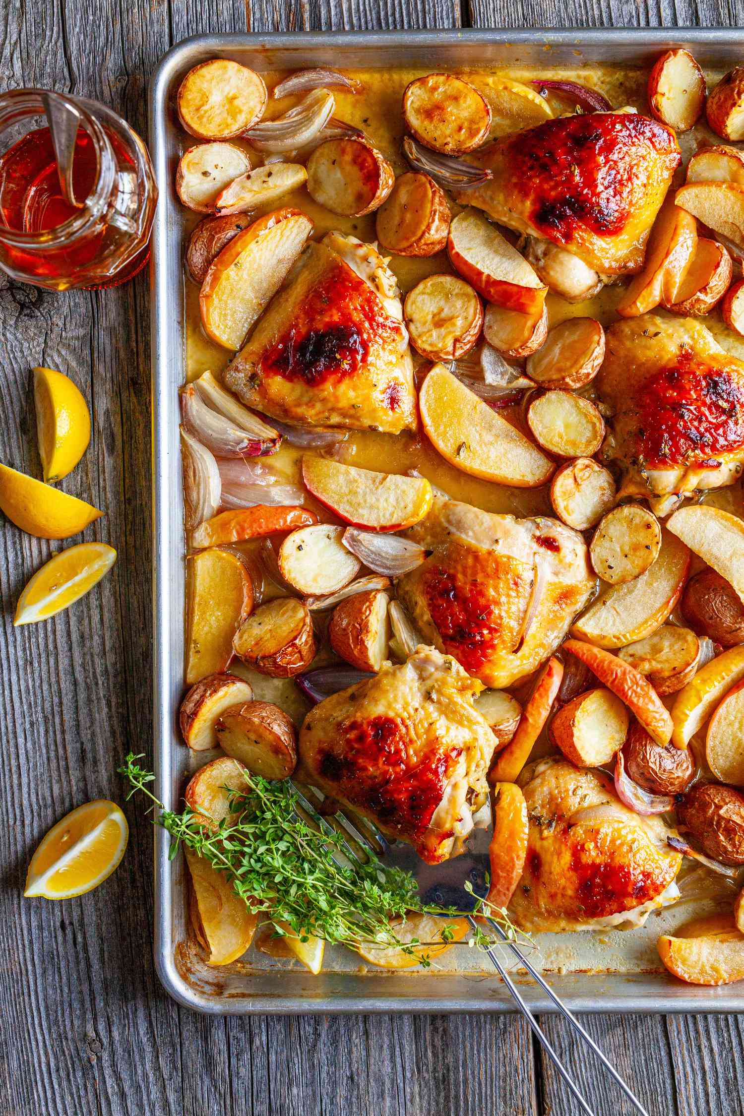 Honey Roasted Chicken Thighs with Baby Potatoes, Apples, Shallots, and Thyme