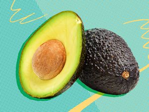 Photo of avocados (one cut in half with pit and flesh facing forward) on an illustrated background