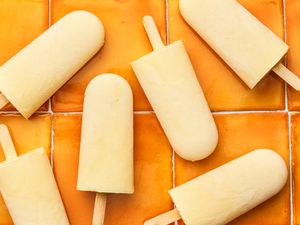 Orange Cream Popsicles on an Orange Tiled Surface