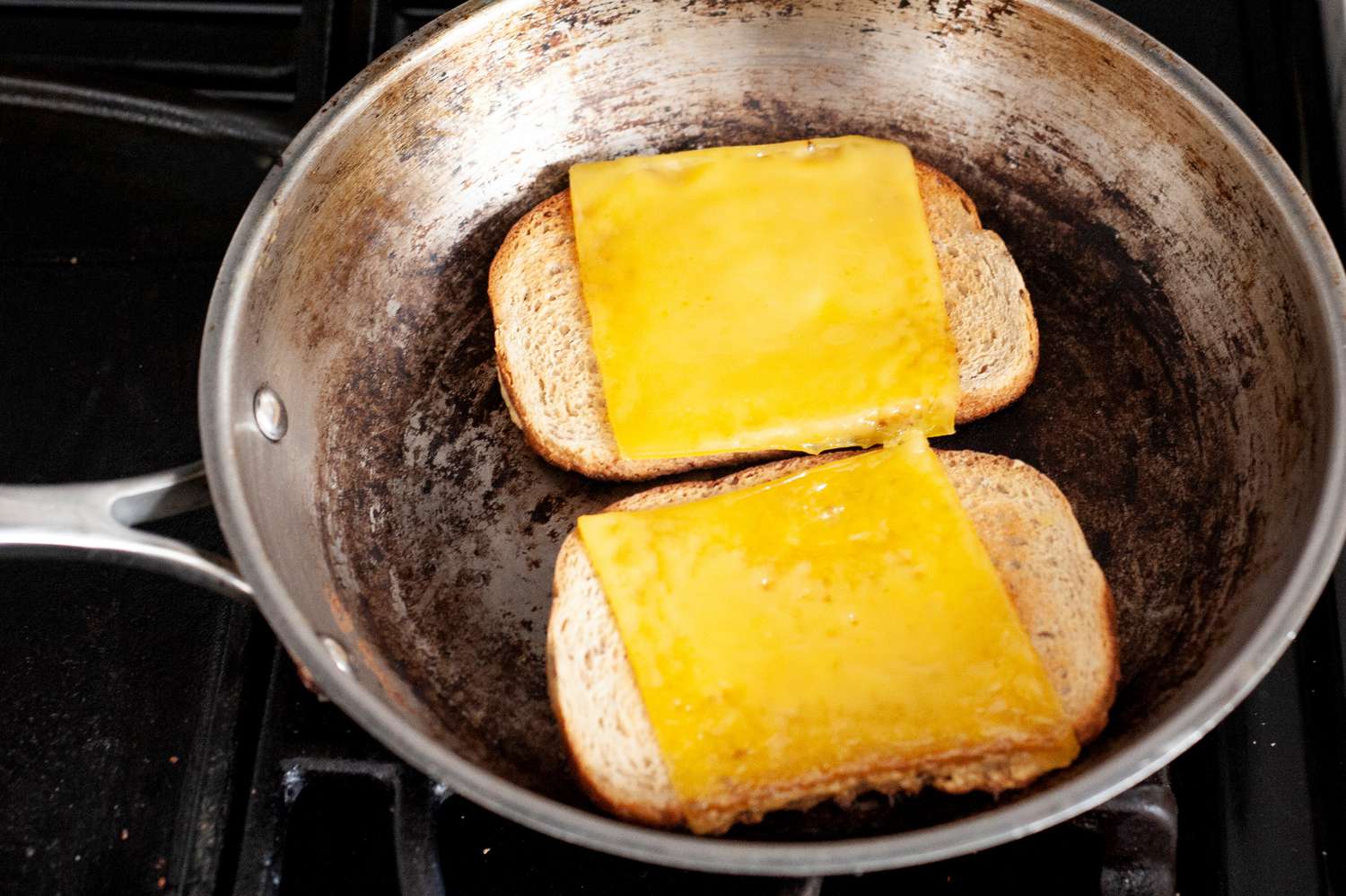 Two Slices of Rye Bread with Melted Cheese in a Skillet for Vegan Patty Melt