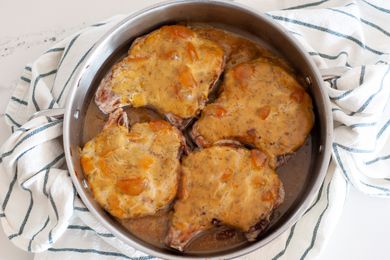 Peach Dijon Pork Chops in a Pan on Top of Kitchen Towel